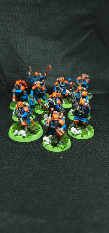 Orange and Blue Veteran Guardsman Killteam by Tim Kaney